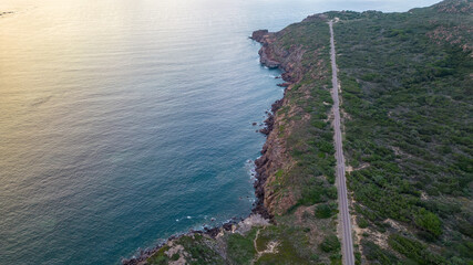 Panorama of Portoscuso, Sardinia. Cycle path and clear sea.