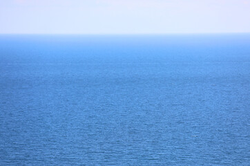 simple background of blue salt water of the sea and the sky on the horizon ideal for a natural background