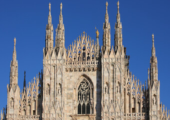 Detail of Facade of Cathedral of Milan also called DUOMO DI MILANO in italian language and golden...