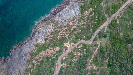 Panorama of Portoscuso, Sardinia. Cycle path and clear sea.