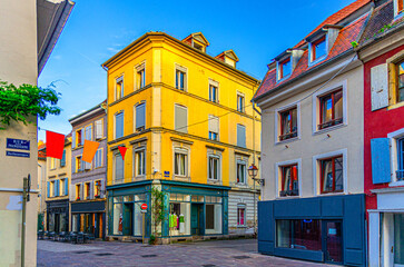 Old town Mulhouse city historic centre with narrow pedestrian street, old colorful buildings, typical multicolored houses, Alsace Grand Est region, France