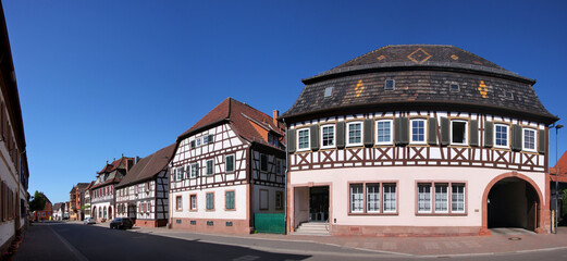 Street with traditional half-timbered houses in the old village of Rheinzabern, Pfalz region in Germany