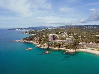Fototapeta premium Aerial landscape view of sunny beach in summer and Mediterranean Sea along Costa Brava in Palamos