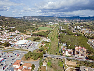 Aerial top down view of river filled with algae bloom in Palamos Catalonia