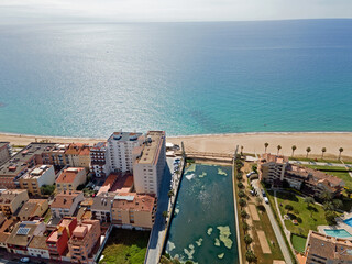 Aerial top down view of river filled with algae bloom in Palamos Catalonia