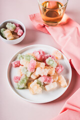 Freeze dried chewy candies on a plate on a table vertical view