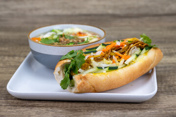 Delicious combination of beef banh mi sandwich and a hot bowl of pho for a delicious Vietnamese cuisine meal