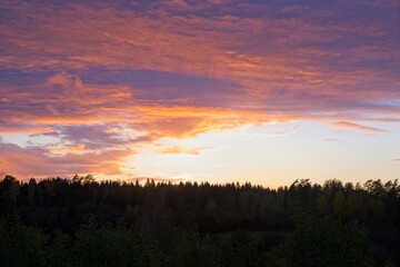 Magical sunset in winter in January over Bredebolet in Skaraborg in Vaestra Goetaland in Sweden on a cold day