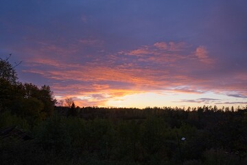 Magical sunset in winter in January over Bredebolet in Skaraborg in Vaestra Goetaland in Sweden on a cold day