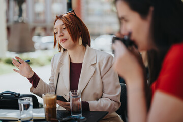 Two business partners engaged in a strategy discussion at a cafe, reflecting teamwork and entrepreneurship.