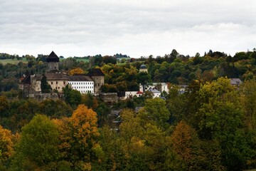 Village with castle ruins in autumn. Sovinec. Czechia.