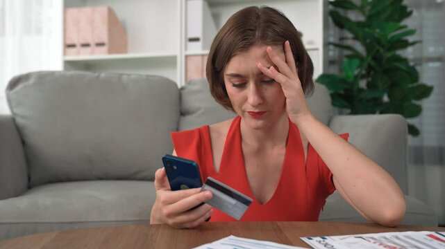 Stressed young woman has financial problems with credit card debt to pay prim from bad personal money and mortgage pay management crisis. Woman worry about financial bankruptcy risk from over spending