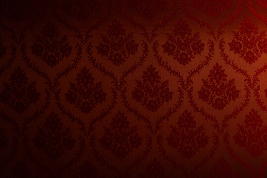 Fototapeta Closeup of red victorian vintage textured textile wall