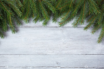 Christmas wooden background with fir branches. Space for copy, congratulations text