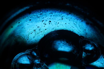 Bright blue reflection of liquid in macro, surrealistic background fantastic smooth surface 	