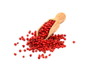 Wooden scoop full of pink peppercorns