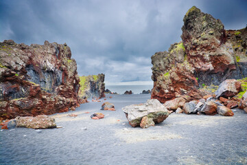 Djúpalónssandur arched-shaped bay of dark cliffs and black sand on the Snaefellsnes Peninsula in western Iceland