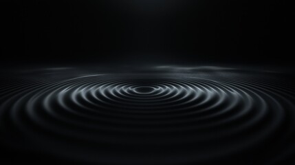 A black and white image of a dark ocean with a few waves