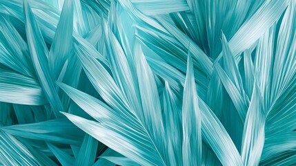 Lush tropical leaves in green and turquoise arranged in a seamless pattern.

