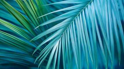 Lush tropical leaves in green and turquoise arranged in a seamless pattern.


