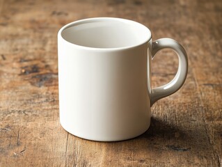 Close-up of a white coffee mug on a plain wooden table with plenty of empty space around, emphasizing simplicity and focus