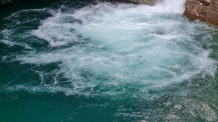 Close-up of turquoise water Johnston Canyon. Banff National Park, Alberta, Canada, August 2024