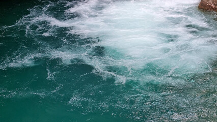 Close-up of turquoise water Johnston Canyon. Banff National Park, Alberta, Canada, August 2024