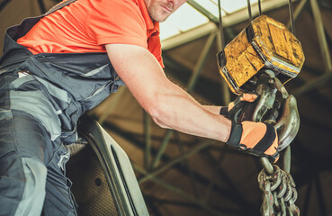 Worker Operating Heavy Machinery in an Industrial Site During Daytime