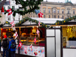 Danish small flags hanging from as ornament in a Christmas market stall in Copenhagen, Denmark 
