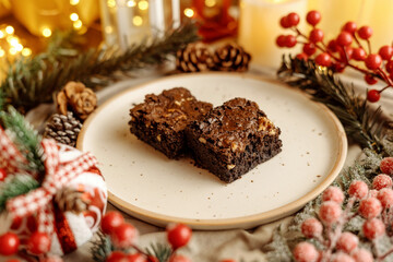Festive Christmas brownie surrounded by holiday decorations, creating a cozy holiday vibe. Perfect for holiday season themes, Christmas treats, festive dessert spreads, and holiday celebration visuals