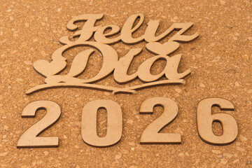 Happy new year 2026 on wooden background