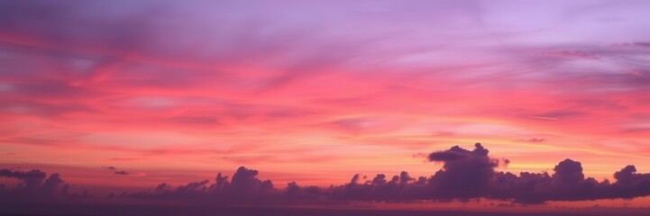 Fototapeta premium Colorful sky with shades of pink, orange, and purple blending together in a peaceful sunset scene, sky, pink