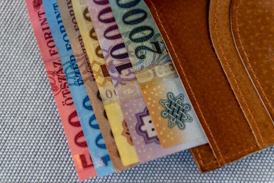 Hungarian forint banknotes in a brown leather wallet.