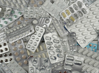 A bunch of empty medicine blisters in close-up. used empty blisters from tablets and the last...