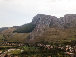tunning Autumn Scenery of Torocko Rimetea, Transylvania: Forested Mountains and Village