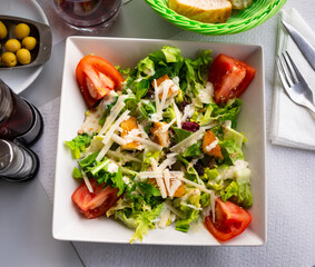 Fresh Caesar salad with chicken breast, lettuce, sauce and cheese