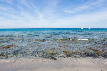 Crystal clear turquoise emerald sea background. Mediterranean Sea in Sardinia, Italy.