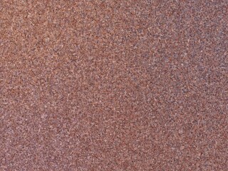 Rusty metal texture background with a rough, granular surface.