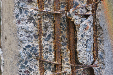 Damaged concrete with rusted steel rods