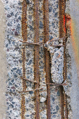 Damaged concrete with rusted steel rods