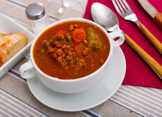 Homemade vegan lentil soup with vegetables, top view