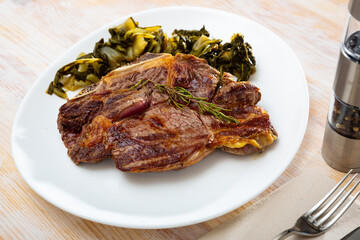Top view on grilled beef with chard
