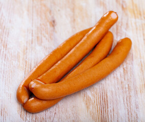 Tasty czech chicken sausages on wooden table