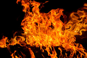 Fire flames on black background. Fire sparks background. Abstract dark fire flames background....