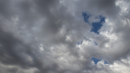 Beautiful dark dramatic sky with stormy clouds before rain or snow. Thunderstorm heaven landscape. Timelapse. High quality photo