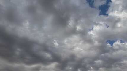 Beautiful dark dramatic sky with stormy clouds before rain or snow. Thunderstorm heaven landscape. Timelapse. High quality photo