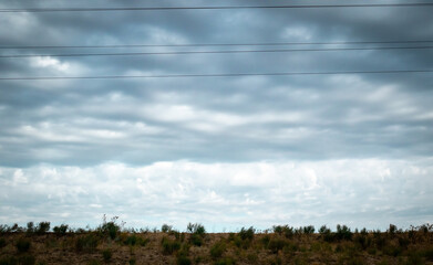 Overcast sky with dark clouds. Dark sky before a thunder-storm. The gray cloud background before rain.