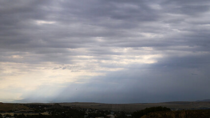 Overcast sky with dark clouds. Dark sky before a thunder-storm. The gray cloud background before rain.