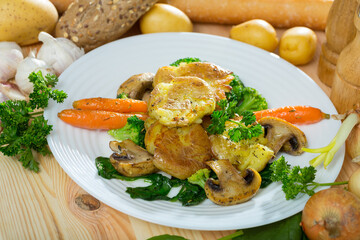 Traditional Australian Crash Hot Potatoes served with baked mushrooms, vegetables and greens
