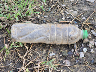plastic bottle on the grass.